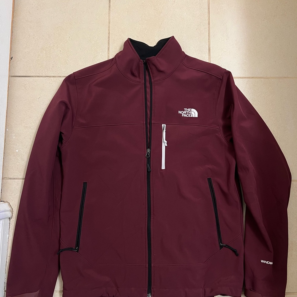 The North Face Red Performance Jacket with High Collar and Zip-Up Style
